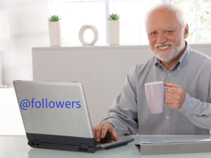 Old man smiling on computer